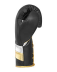 Black and gold adidas Adi-Speed 500 boxing glove.