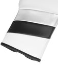 White and black glove designed for boxing and training.