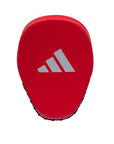 A red curved focus mitt with a logo.