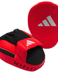 Red and black boxing glove for training.