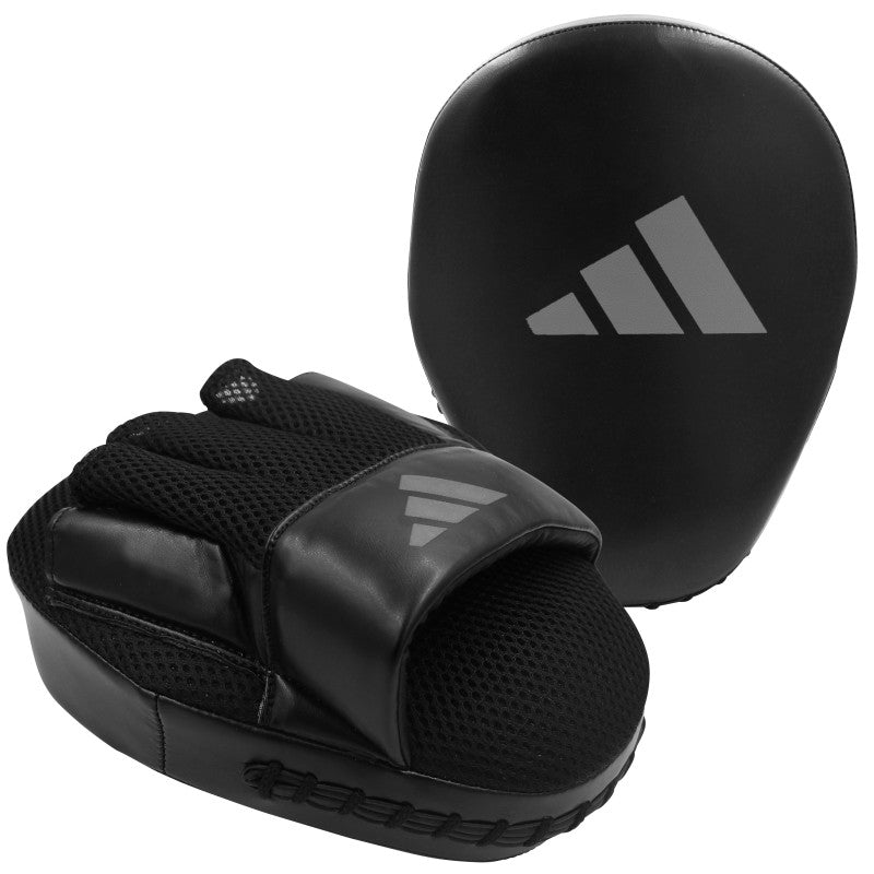 Black boxing glove and pad for training sessions.