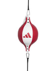 Red and white punching bag for boxing.