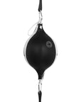 Black and white punching bag used for boxing.