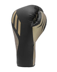 A black and gold boxing glove for training.