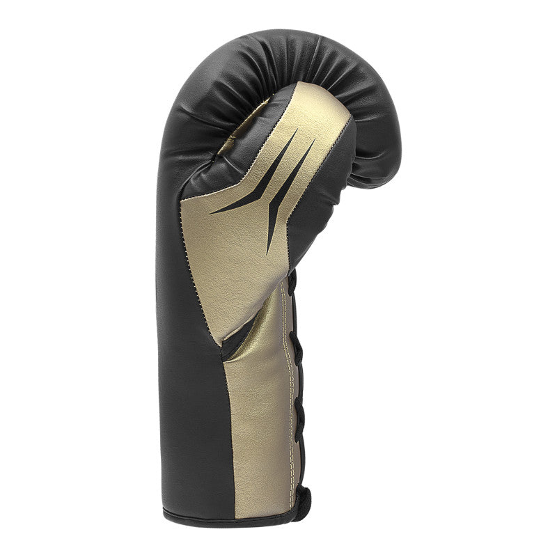 A black and gold boxing glove for training.