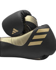 A pair of boxing gloves for training, lace-up design.