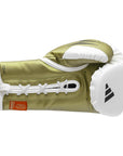 A black boxing glove with white laces.