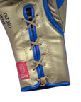 Close-up of a blue and gold boxing glove for Tilt 350 PRO Training.