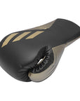 A black and gold boxing glove from the Tilt 350 PRO.