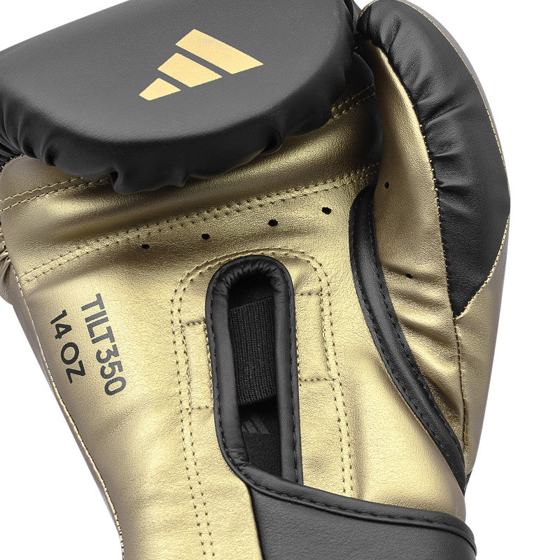 Gold boxing glove with black leather detail for training.