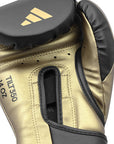 Gold boxing glove with black leather detail for training.