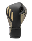 Single black and gold Tilt 350 PRO training boxing glove made from sustainable leather.