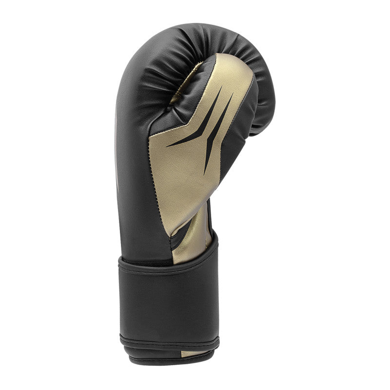 Black and gold boxing glove in White/Gold Met color, 12 oz weight.