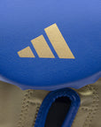 Close-up of a blue and gold logo on Tilt 350 PRO training gloves.