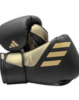 Black and gold Tilt 350 PRO training boxing gloves made from sustainable cactus leather.