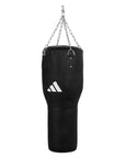 Black punching bag with chain for boxing training.